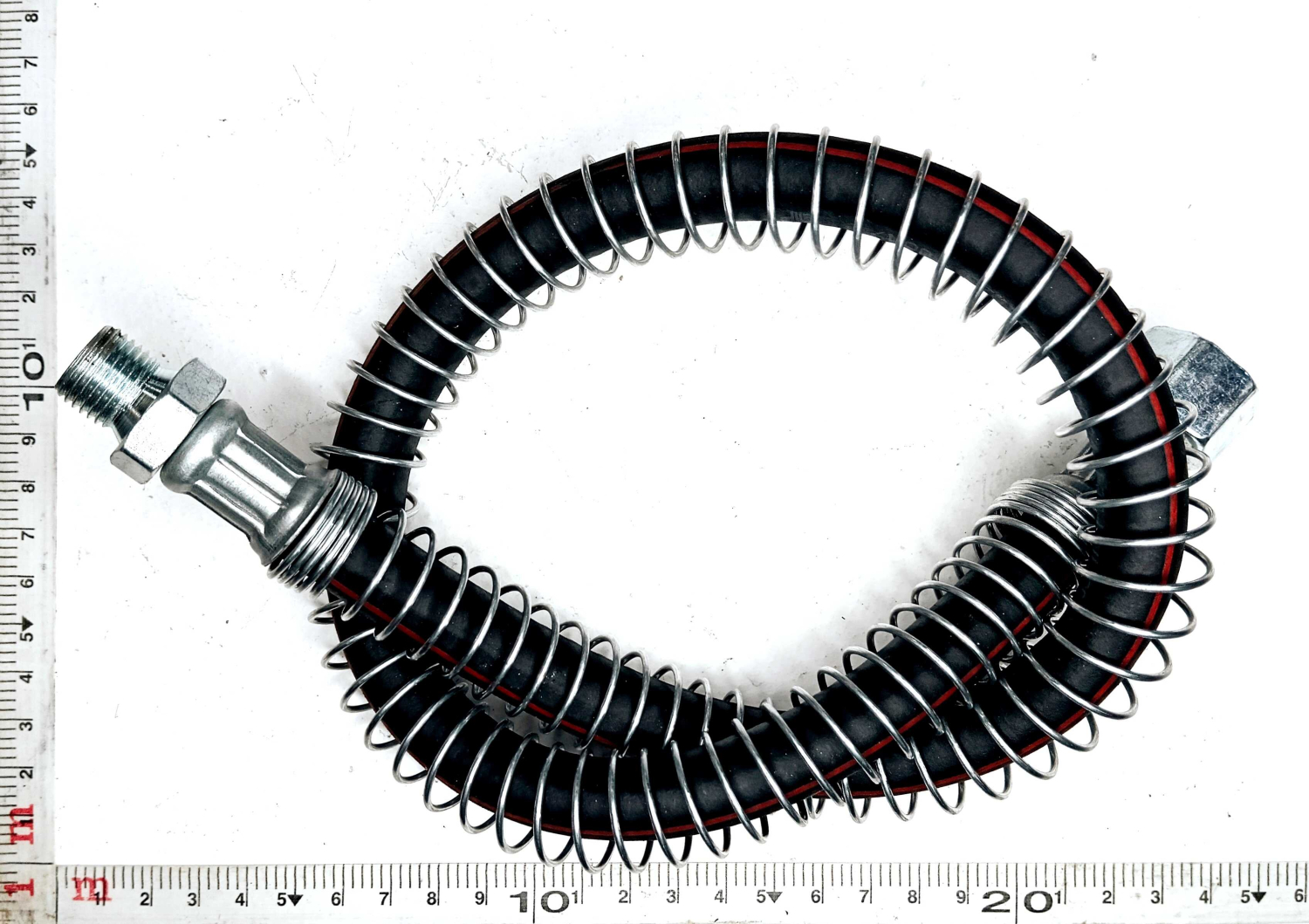 Шланг тормозной 4310 передний (гайка-штуцер) в пружине 65см